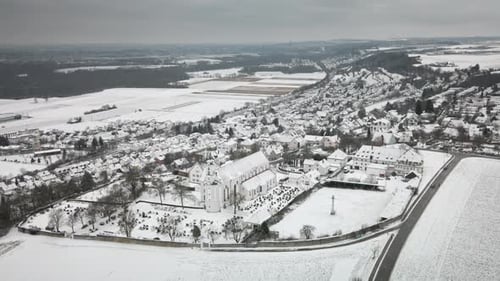 Descending Forward Drone Snowy Village Approach