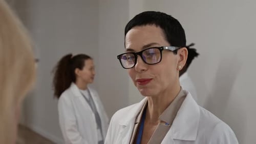 Medical Professionals Discussing Healthcare in Clinic Setting