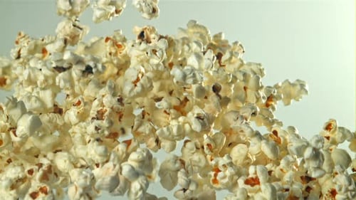 Popcorn Flies Up and Falls Down On a Light Background Filmed on a Highspeed Camera at 1000 Fps