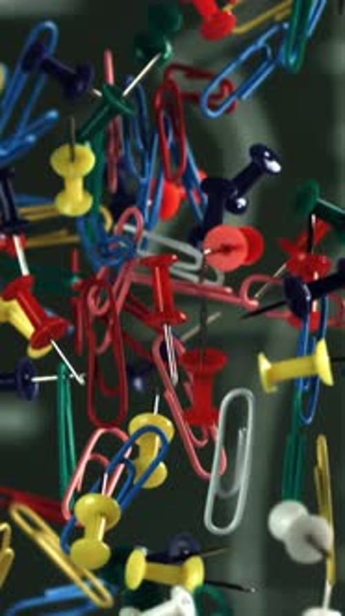 Multicolored Paper Clips Fly Up and Fall Down Filmed on a Highspeed Camera at 1000 Fps