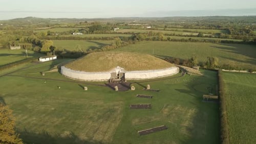 Bru na Boinne - Newgrange Monument With Green Meadow Landscape At Sunrise In County Meath, Ireland.