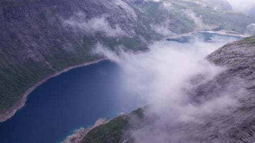 Beautiful nature Norway natural landscape Lovatnet lake flies above the clouds. fjords and mountains