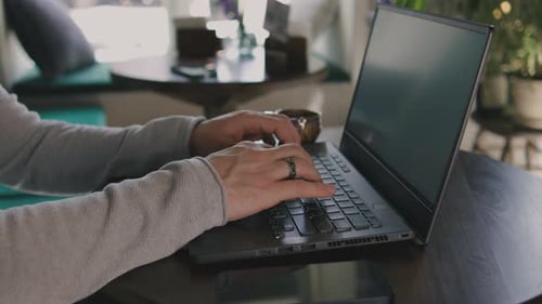 Close Up of Freelancer's Developer Hands Typing Program Code on Laptop Keyboard in Coworking