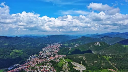 View From Rock to Town of Smolyan with Meadows for Cattle Walking and Houses Between Mountain Range
