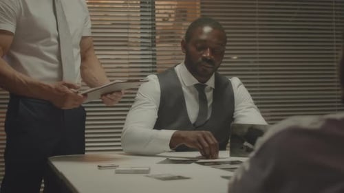 Intense Police Interrogation with Photographs in Urban Office