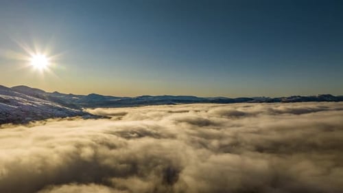 Aerial View Above Cloudscape in Golden Hour Sunlight