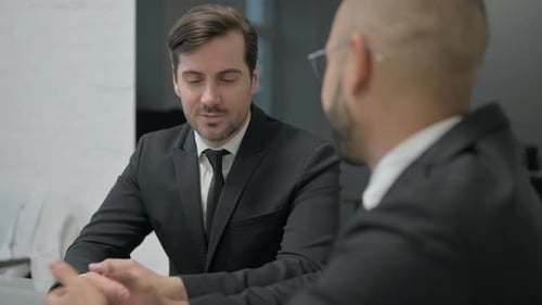 Close up of Businessman Talking with Businessman