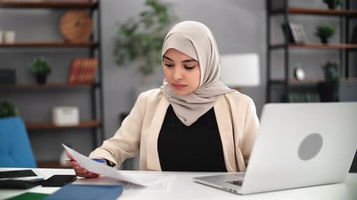 Success Saudi Muslim Business Woman Working Paper Document Laptop Accountant Employee at Workplace