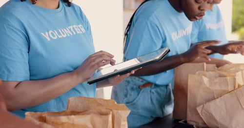 Tablet, food donation and community volunteering for non profit, charity