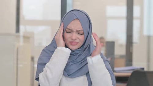 Woman in Hijab with a Severe Headache