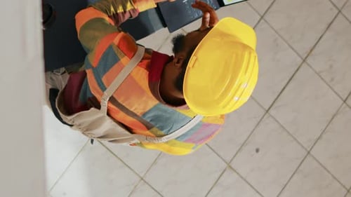 Vertical Video Team of People Analyzing Logistics List on Papers