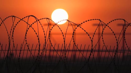 Barbed Wire Fence at Sunset Protected Area