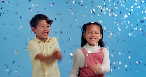 Fun, friends and children in studio with confetti for kids party, happy winning or prize giveaway
