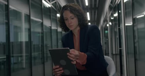 Businesswoman Working on Digital tablet in Office at Night