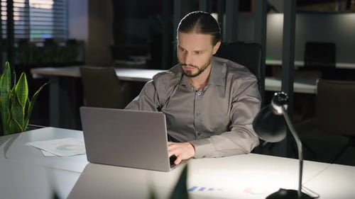 Caucasian Businessman at Office Workplace with Laptop Working Thinking Strategy Analyzing Data