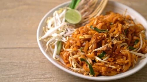 Delicious Pad Thai Noodles on White Plate