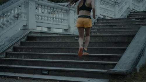 Young Girl is Climbing Stairs during Morning Run.