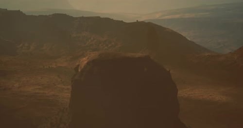 Expansive Landscape View Showcasing Rugged Terrain and Rocky Formations at Dusk