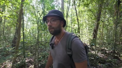 Forest trekking, travel adventures, exploration journey, young male