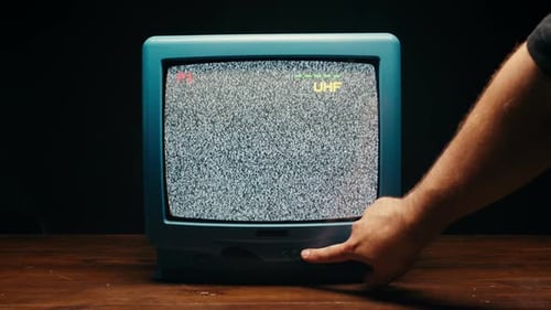 Vintage Television Static with Hand Pressing Button