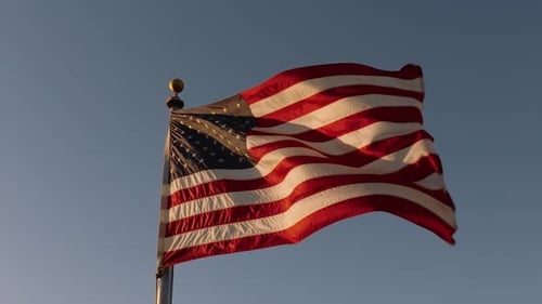 American Flag Waving Proudly Against a Clear Sky