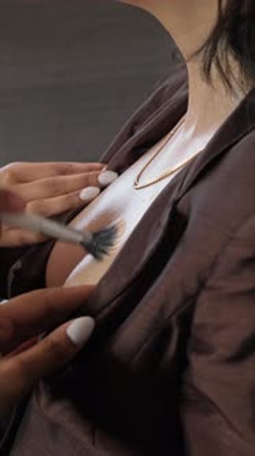 Woman Getting Makeup Applied with Brush