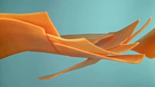 Cheese Slices Forming Abstract Shape on Blue Background