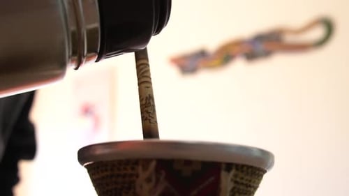 Mate Tea Pouring in traditional Argentinian Mate cup