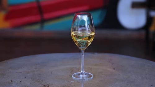 Glass of Wine on Table in Urban Setting