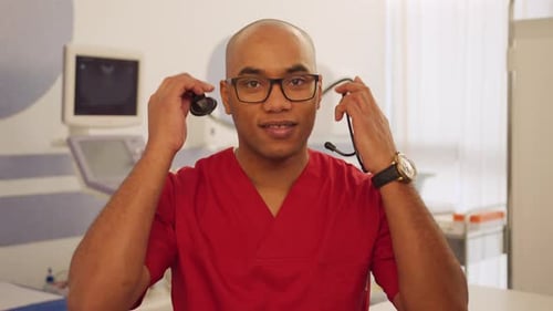Medical Professional with Stethoscope in Exam Room