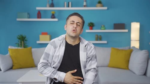 Man experiencing stomachache.