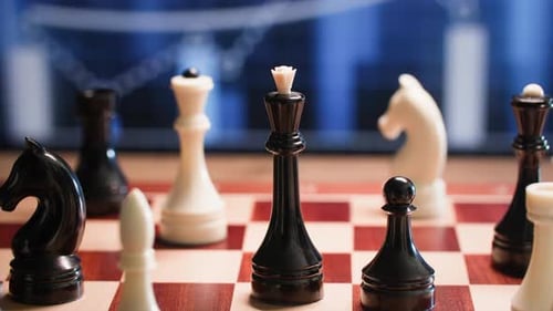 Strategy and Business Development Chess Piece Moving on Chessboard Close Up