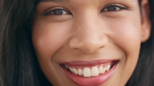 Smiling Young Woman's Face Close-up