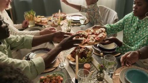 Family Gathered Around Table Sharing Meal