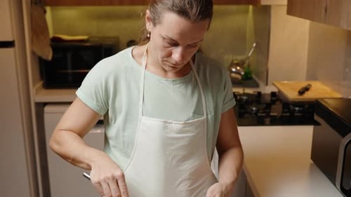 Woman mixing batter in a kitchen