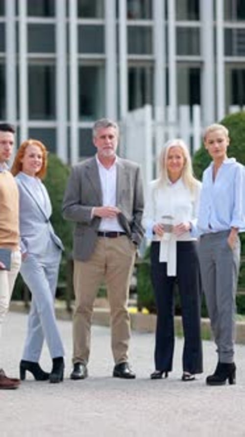Business Professionals Standing Outside Office Building