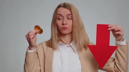 Woman Showing Bitcoins BTC Down Sign Decrease of Exchange Rate Fall of Stock Cryptocurrency Market