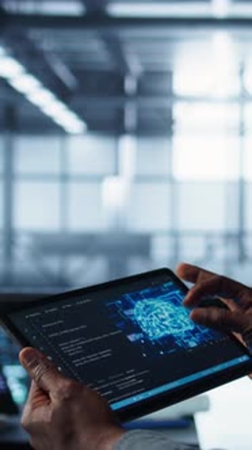 Vertical Video Close Up of Computer Scientist in Data Center Uses AI on Tablet