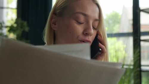 Happy Caucasian Girl Businesswoman Talk Mobile Phone at Office Discuss Business Documents with