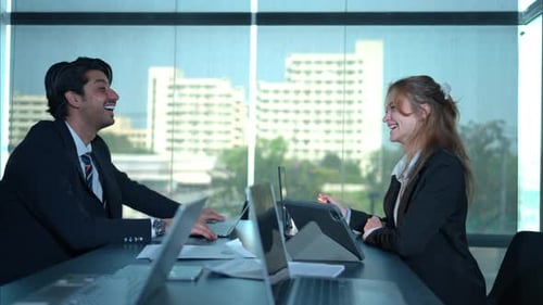 In the office, two businessmen and women discuss and exchange idea and give advice to each other