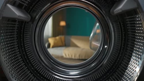 View From Inside the Empty Washing Machine with an Opened Door Into the Beautiful Living Room Slow