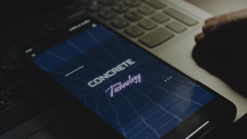 Concrete Technology Inscription on Smartphone Screen Construction Concept Male Hand Flapping with