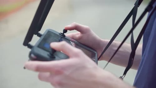 Drone Controller Being Operated Outdoors