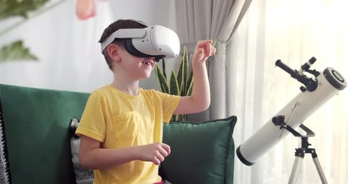 Boy Exploring Virtual Reality with VR Headset Indoors
