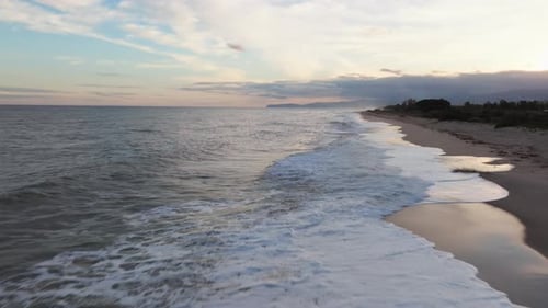 Foam Of The Waves On The Beach