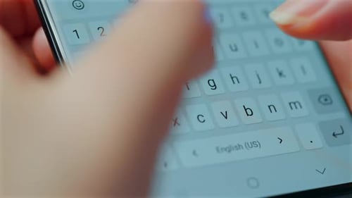Person Typing on a Mobile Phone Screen