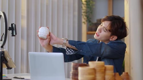 Young Adult Making Product Review Video at Home