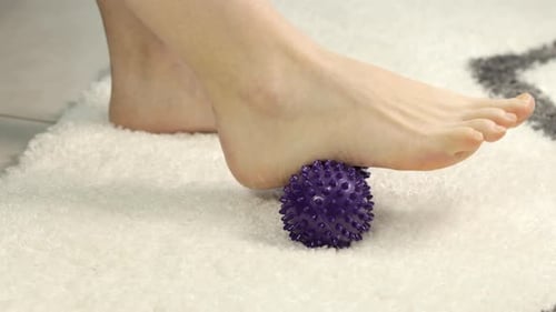 Foot Massage with Spiky Ball on Rug