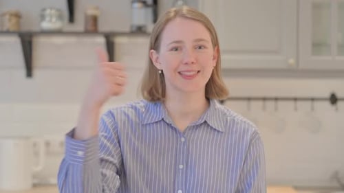 Woman Gives Thumbs Up of Approval