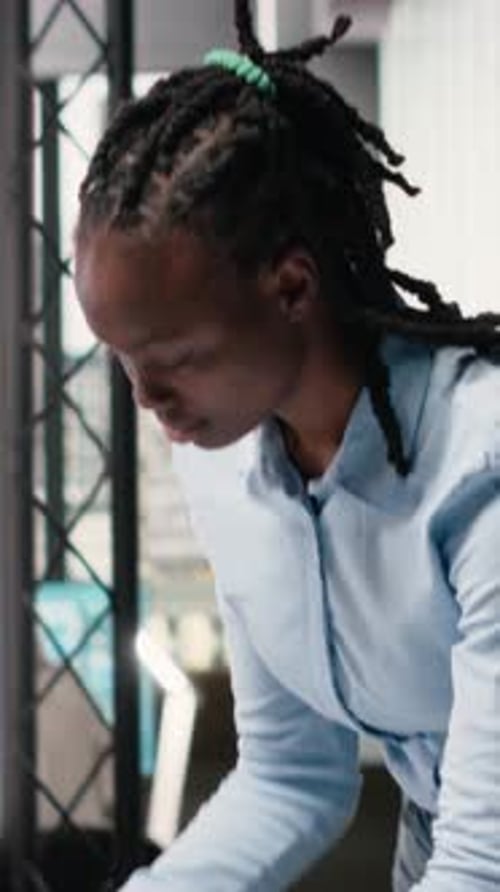 Vertical Video African American Contractor Reviewing Architectural 3D Models for the Future